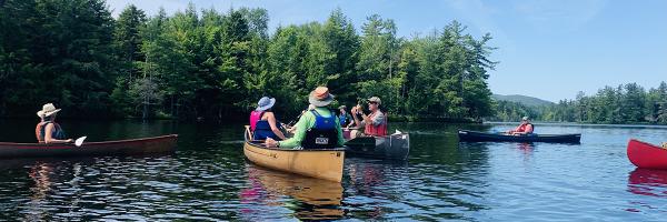 Ausable River Association Tour of Lower Saint Regis Lake in the Adirondacks of New York. Photos: Carolyn Koestner, AsRA People canoeing on Lower Saint Regis Lake